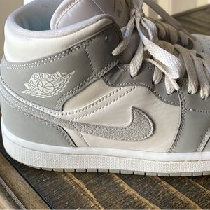 Gray and white Jordan’s 1s